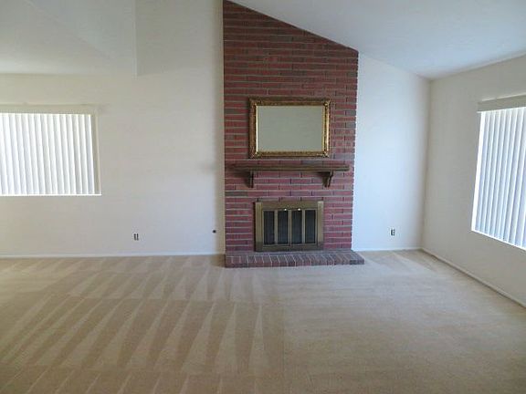 Living room with a brick fireplace