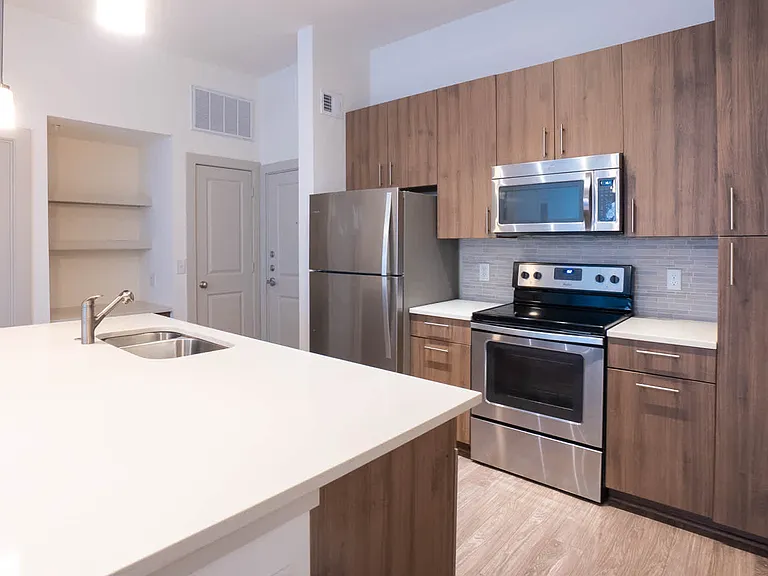 Kitchen with Breakfast Bar and Stainless Steel Appliances
