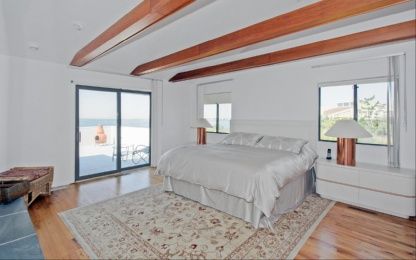  Master bedroom with sliders to pool deck and marvelous views