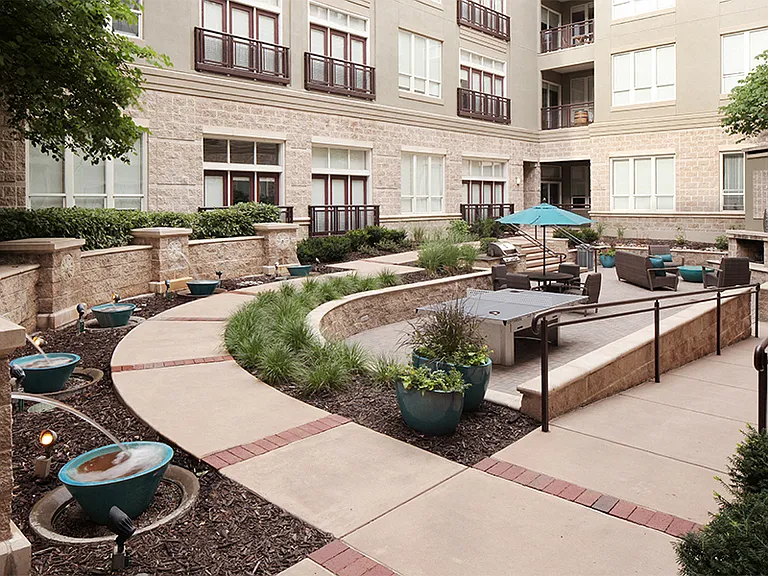 Courtyard equipped with fireplace, BBQ grill and ping pong table