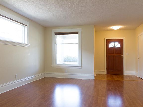 View of living room and entry from dining area