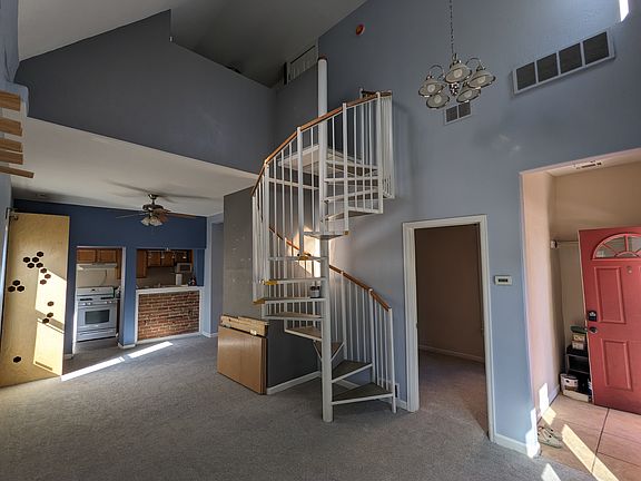 Entry/living space. Stairs to loft.