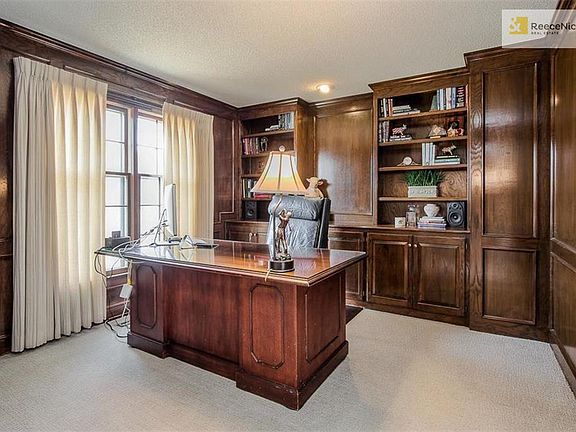 Deluxe paneled study with built-ins.