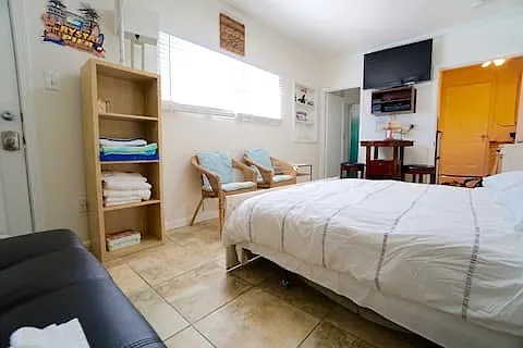 Queen sized bed pulls out from the wall when it's time to sleep.