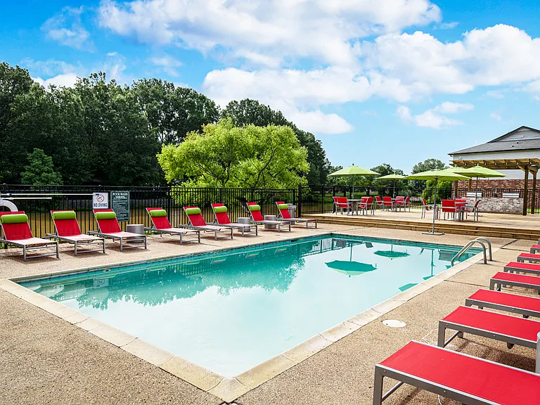 Unwind poolside under the sun at Southwind Apartments in Richland, MS!