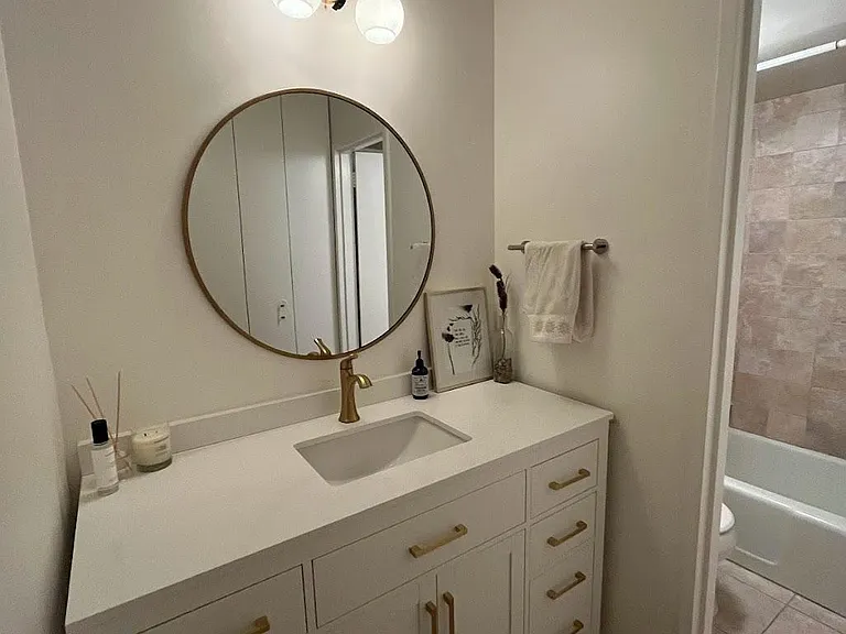 renovated bathroom vanity with dimmable lights and lots of storage