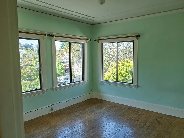 Bedroom on southwest corner receives excellent light, and has hardwood floors.