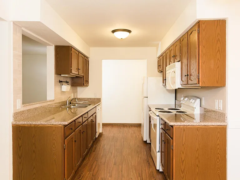 901 sq. ' Granite topped Kitchen with Tile and Formica Back Splashes. Built in Microwave.