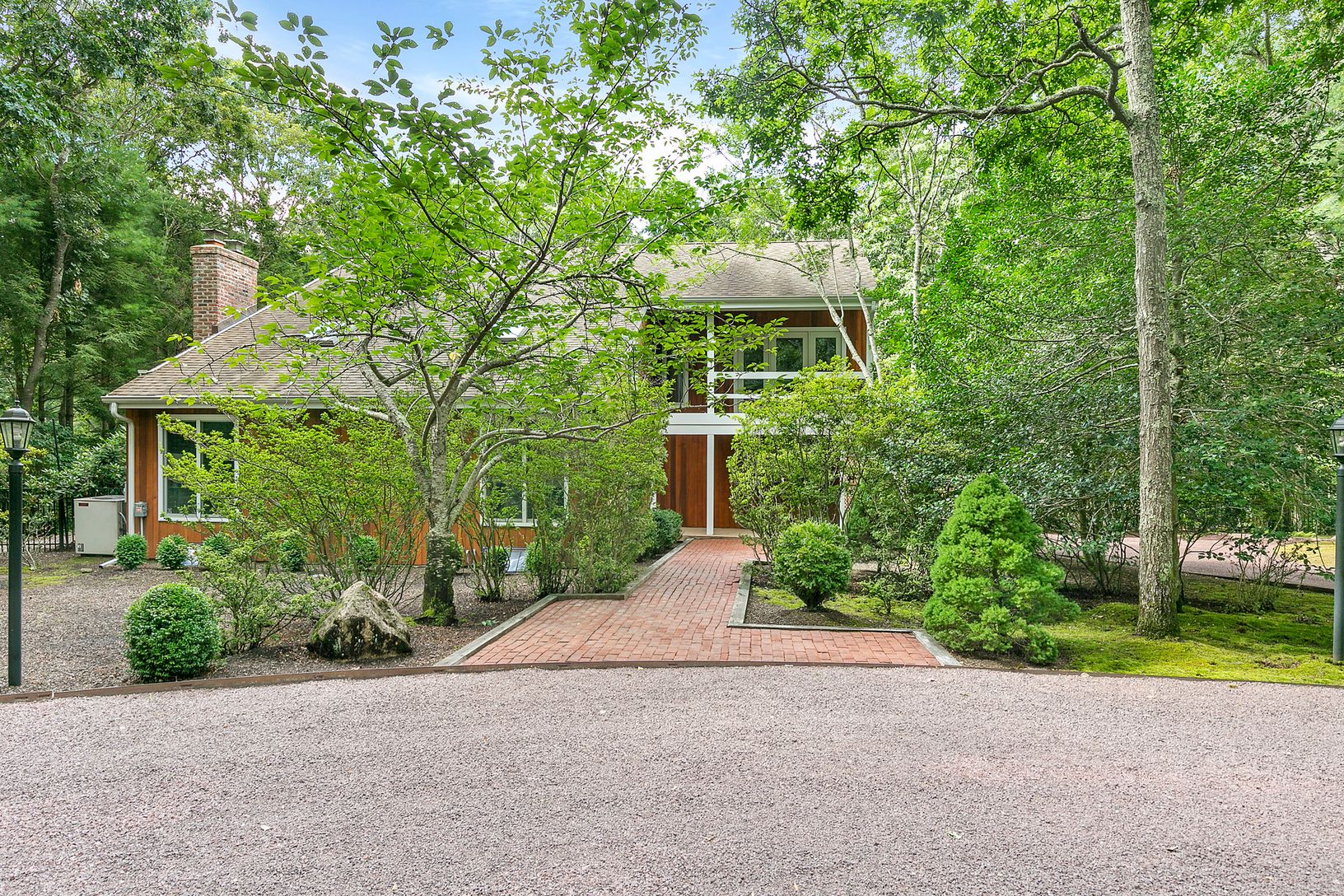  Beautiful, mature landscaping with circular driveway