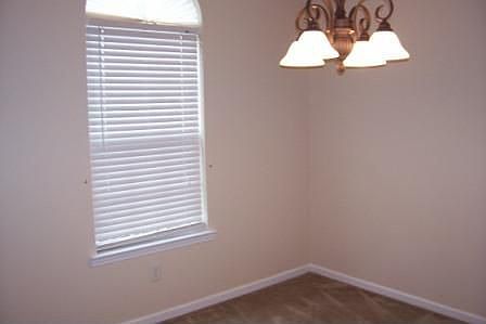 Formal diningroom with designer window