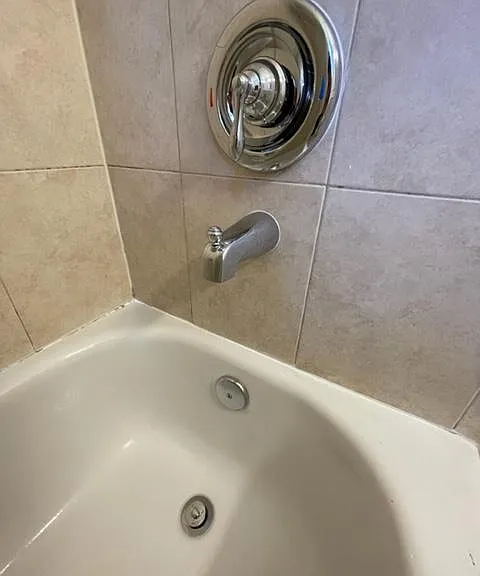 New trim kit to turn water on and off, new tub spout and new drain in tub