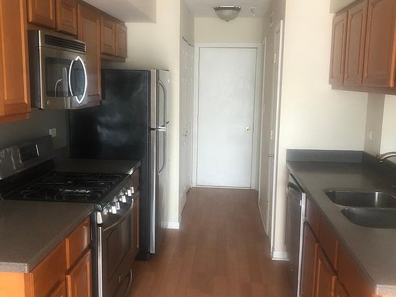 Kitchen. Stainless steel appliances and corian counter tops.