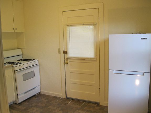 kitchen- stove, exterior door, refrigerator