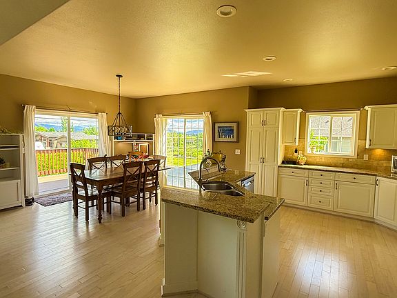 the table will be removed, the cabinet/desk in the far corner will stay