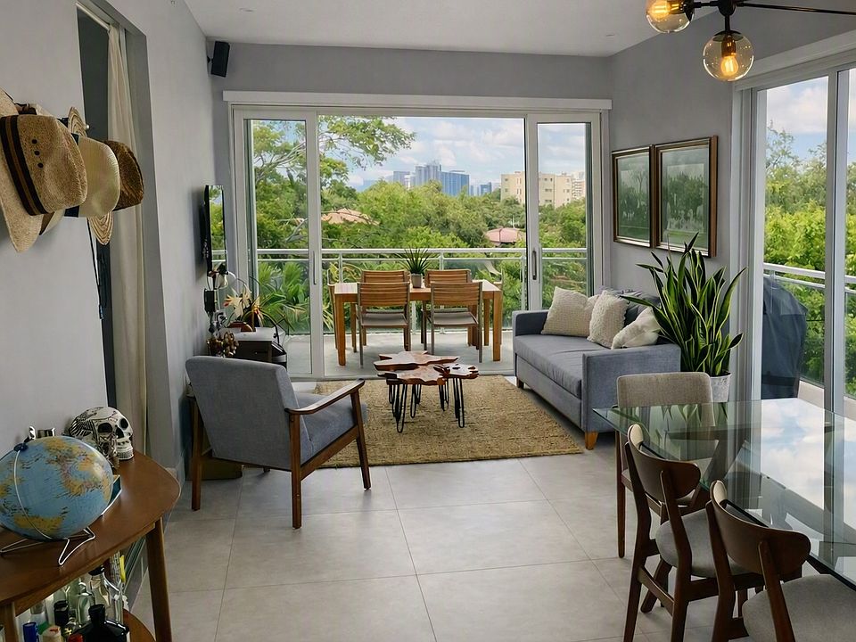 beautiful living room / dining room with double sliding imapact doors facing south with large deep 350 SF terrace, 8' deep