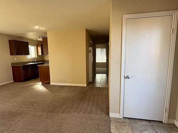 View from living room into hallway & kitchen