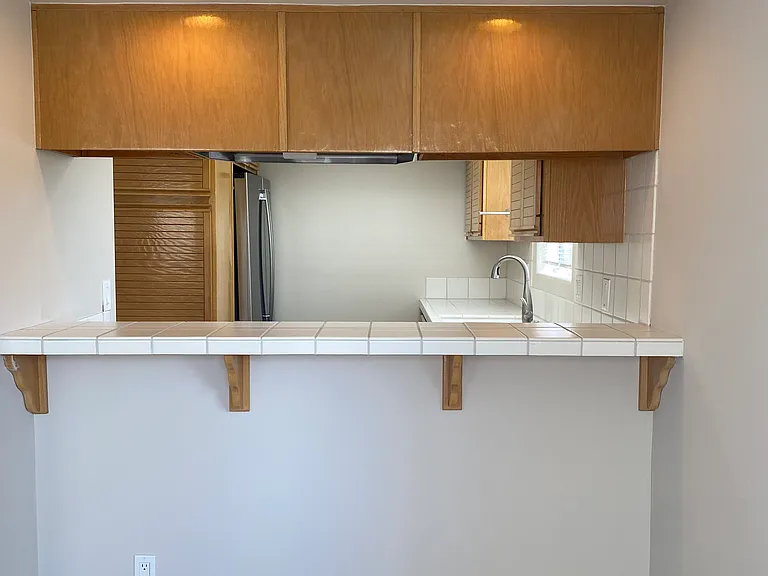 Bar Counter Area with Pass Through to the Kitchen