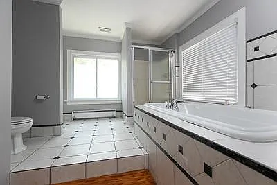 His and hers showers. Jacuzzi Tub. Tile and Marble floor and walls. 2 new windows with screens to allow air flow for attic fan.