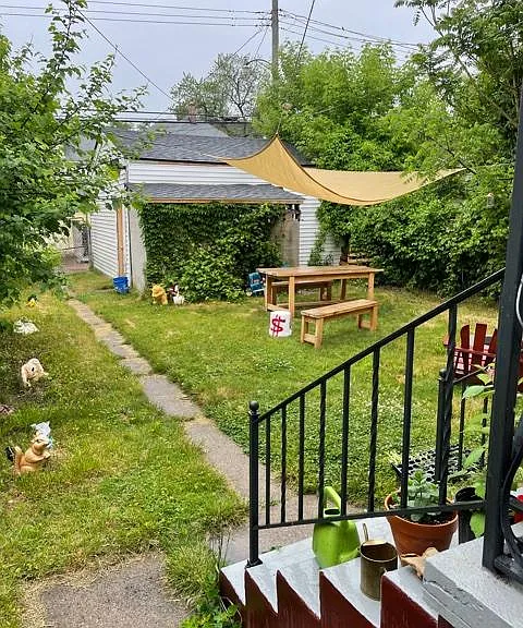 The backyard can be made into a comfortable gathering place for friends and family. Note that the furniture is not included in the lease.