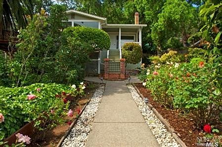 walk way to house through rose garden and fruit trees