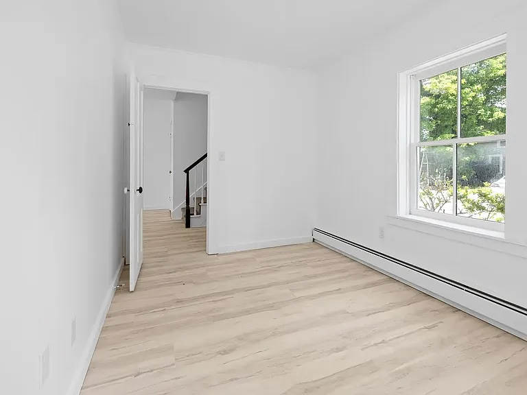 Bedroom One - First Floor. Space for a queen bed or two twins with headboard to the left in this photo.