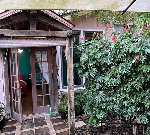 Artistic front door and patio.