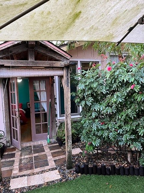 Artistic front door and patio.