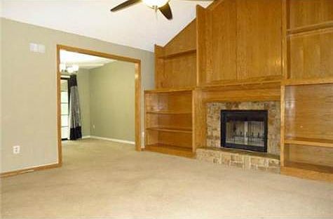 Fireplace is flanked by gorgeous built-ins