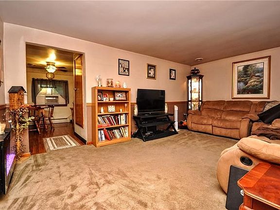 Imagine cuddling up for a movie night while snow falls onto the Pine trees surrounding the property.