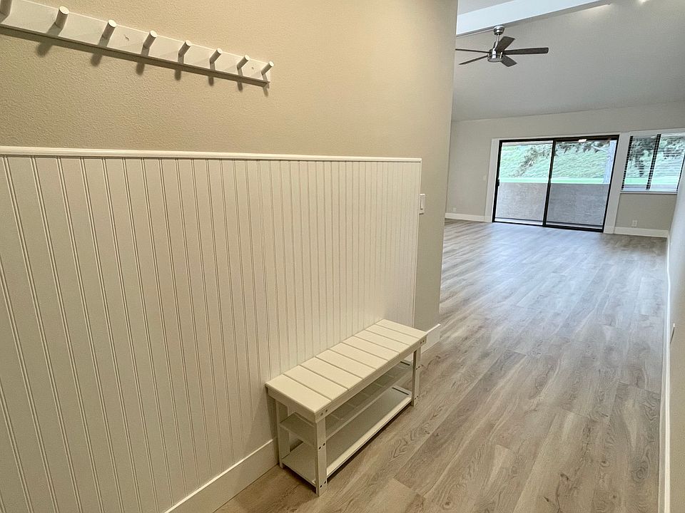 Inviting, airy Carlsbad beach-style entrance designed for easy coastal living_featuring a charming spot to kick off your shoes, hang your coat, and leave your worries behind as you step into your personal retreat