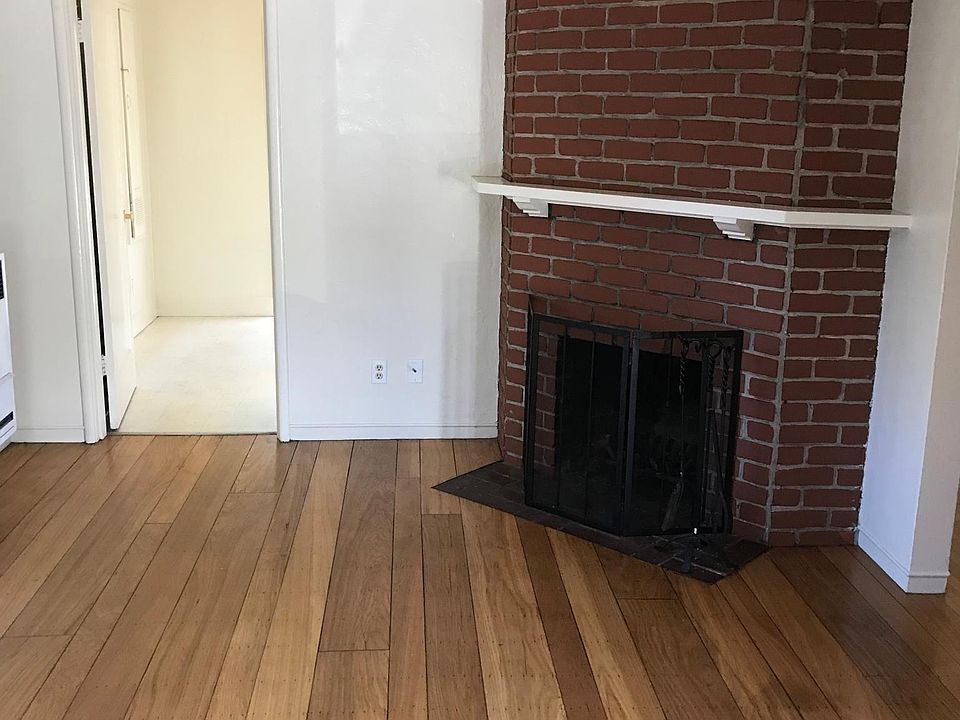 Living room with hardwood floors and fireplace