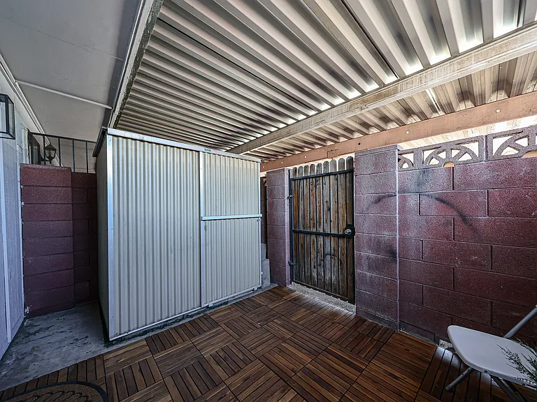Covered patio with storage unit