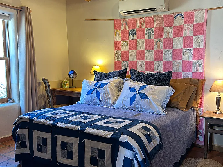 Nambe Casita bedroom. All bedding is included with additional sheet sets, blankets, light quilts and down alternative quilt.