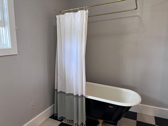 Bathroom with antique claw foot tub