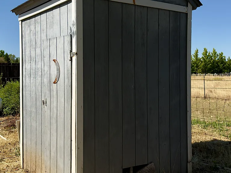 well house with shelving for additional storage