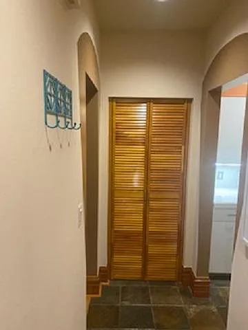 Hallway between kitchen, bedroom and bath
