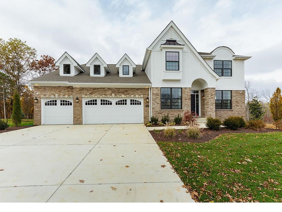 Impressive Front Elevation with 5 Car Garage (2 Cars are Tandem)
