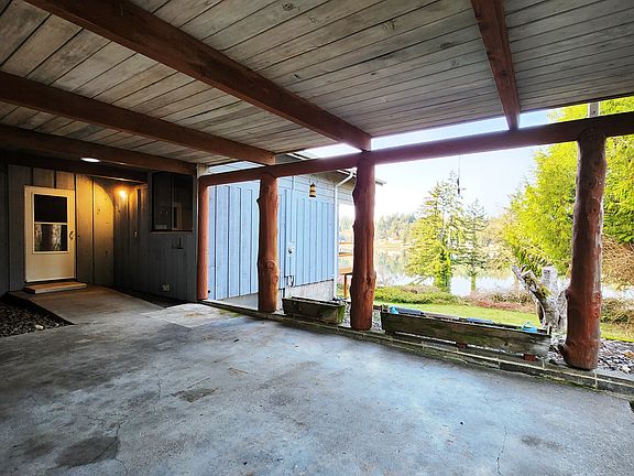 View of the front door and the water from the XL carport.