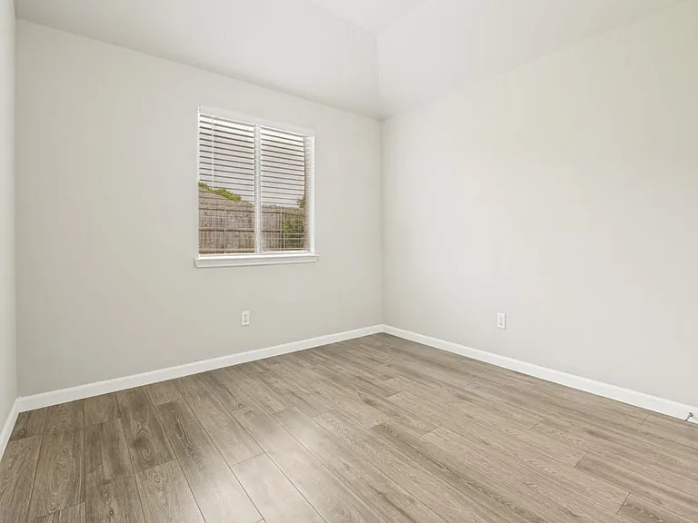 Secondary bedroom with closet