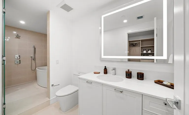 Sky Residence D primary bathroom featuring a luxurious tub and refined design details.