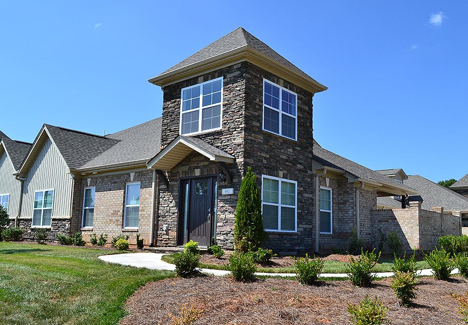 This two-story townhome features a large master su