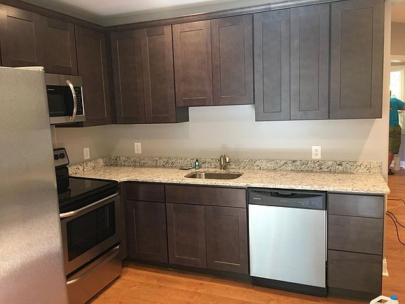 Kitchen, dishwasher, large frig, microwave, electric stove. Granite countertops