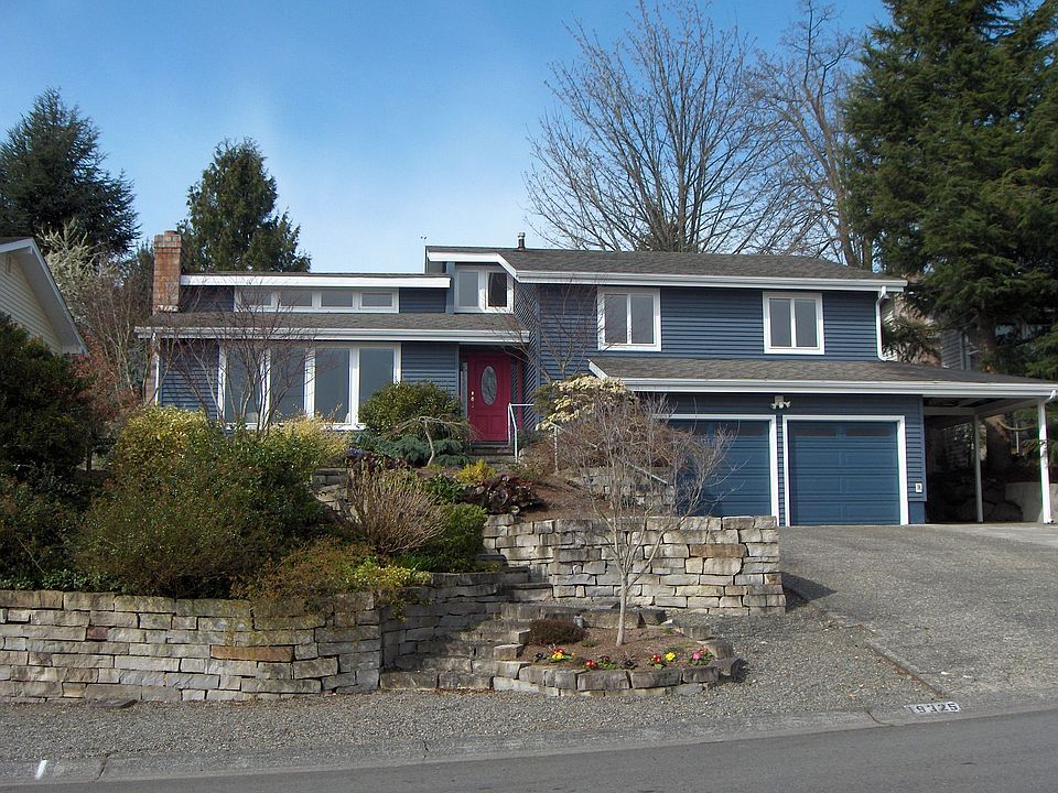 Terraced front yard with established gardens