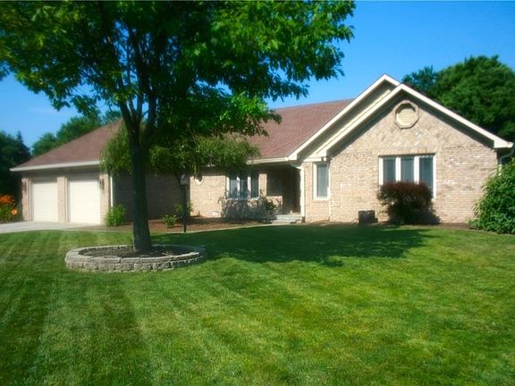 All brick, custom built, solid construction.  Garage is extended depth, to allow for 2 cars, plus plenty of storage for yard equipment, bikes, etc.  Pull down stairs to attic with lighting and flooring too.