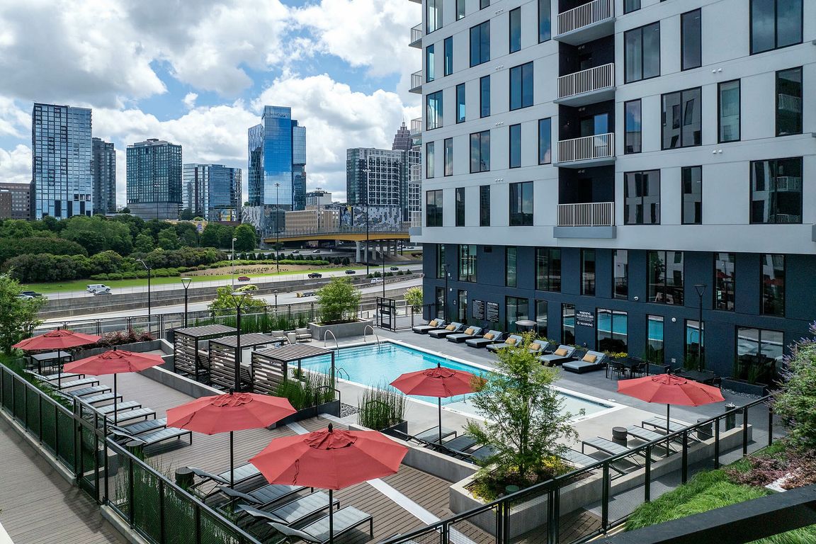 Resort style swimming pool with skyline views