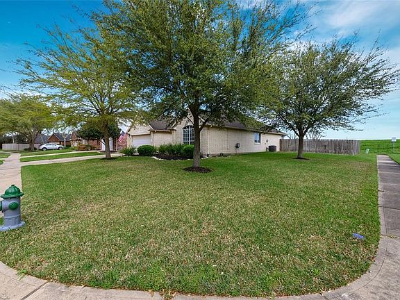 Showcase home on spacious corner lot. Three mature trees, beautiful landscaping with fresh mulch, and front yard sprinkler system!
