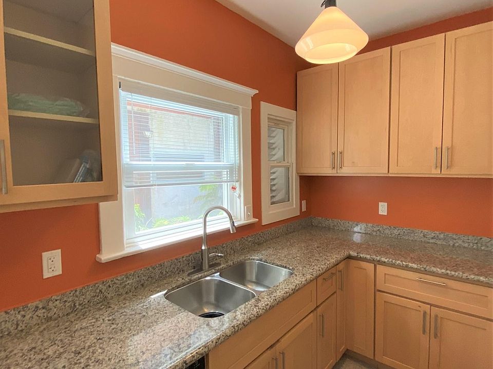 Huge kitchen, tall ceilings, tons of cabinet space, and a California cooler