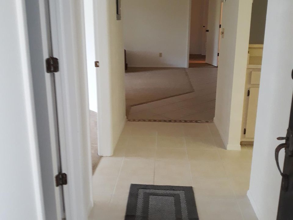 Hallway; bathroom and bedroom to the left, kitchen to the right