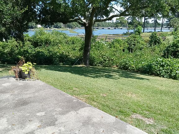 View off the patio -- look hard and you will see the bridge crossing Bradley Creek on Oleander. Again, more privacy which is important to me; but not sure about you!