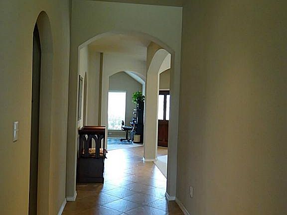Entry with lovely arches and columns. Plenty of extra storage space too.